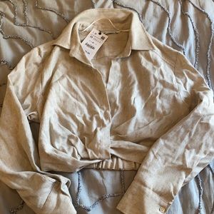 cropped, collared beige long sleeve shirt